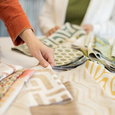 Hand picking up decorative fabric.