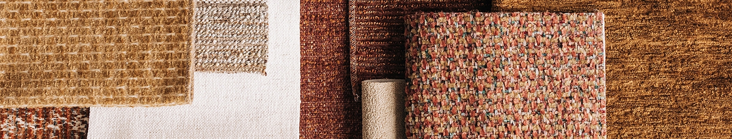 Fabric swatches of different neutral shades and textures overlapping