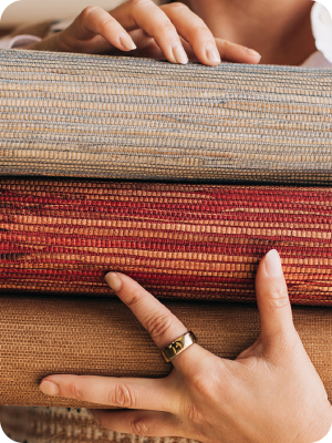 Hands holding a stack of fabric