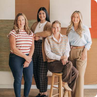 Four women smiling together