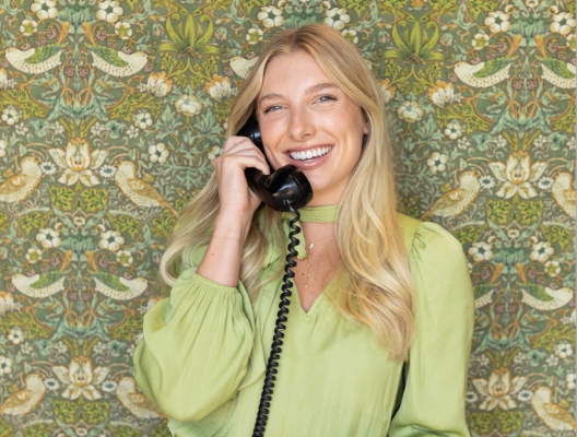 Woman smiling while talking on the phone