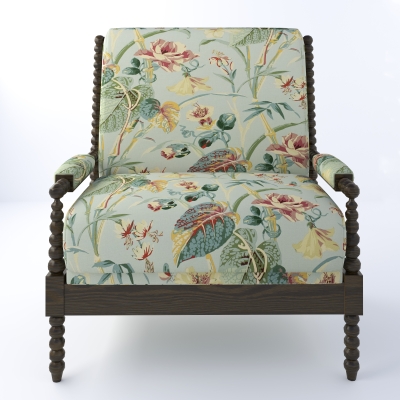Chair with dark wood legs upholstered with a soft green floral fabric.